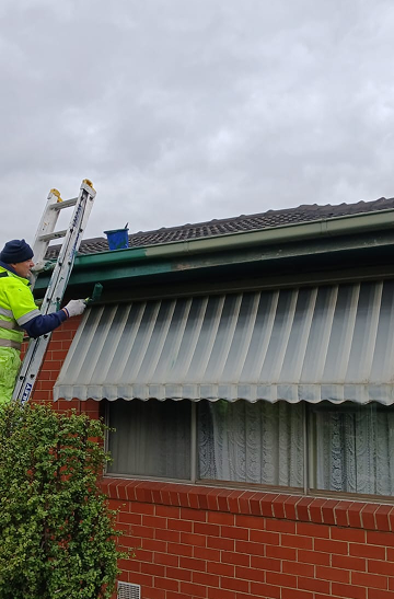 House with person on ladder